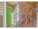 Inviting entrance features a green front door with a 
