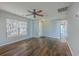Spacious living room with hardwood floors, ample natural light, and a ceiling fan at 108 Chemistry Cir, Ladson, SC 29456