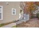 The side of the home offers a private outdoor area with a white picket fence and garden at 108 Chemistry Cir, Ladson, SC 29456