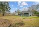 Large backyard with a wooden privacy fence and mature trees at 1146 Rivercrest Dr, Charleston, SC 29412