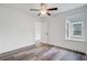 Bedroom showcasing hardwood floors, ceiling fan, and natural light from a large window at 1146 Rivercrest Dr, Charleston, SC 29412