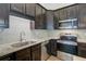 Modern kitchen with stainless steel appliances, granite countertops, and stylish backsplash at 1146 Rivercrest Dr, Charleston, SC 29412