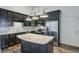 Kitchen with stainless steel appliances, center island, dark cabinets, and bright countertops at 1146 Rivercrest Dr, Charleston, SC 29412
