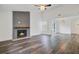 Bright living room with a modern fireplace, high ceiling, and beautiful floors at 1146 Rivercrest Dr, Charleston, SC 29412