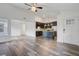 Bright living room with updated kitchen and island, and beautiful wood-look floors at 1146 Rivercrest Dr, Charleston, SC 29412