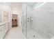 Modern bathroom with a glass-enclosed shower, marble tile, and double vanity sinks at 1155 Darling St, Summerville, SC 29485