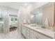 Modern bathroom features marble countertops, double sinks, and glass shower at 1155 Darling St, Summerville, SC 29485
