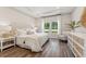 Cozy bedroom featuring a large window, tray ceiling, and stylish decor at 1155 Darling St, Summerville, SC 29485