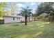 Spacious backyard with a wooden deck and mature landscaping creates a private outdoor space at 1174 Fort Johnson Rd, James Island, SC 29412