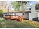 Spacious backyard with a wooden deck and mature trees at 1174 Fort Johnson Rd, James Island, SC 29412