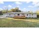Charming single-story home featuring a covered front porch and well-manicured lawn at 1174 Fort Johnson Rd, James Island, SC 29412