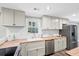 Bright kitchen with stainless steel appliances, butcher block counters, white cabinets, and a subway tile backsplash at 1174 Fort Johnson Rd, James Island, SC 29412