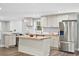 Modern kitchen featuring stainless steel appliances, butcher block countertops, and stylish white cabinets for a sleek design at 1174 Fort Johnson Rd, James Island, SC 29412