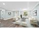 Bright, airy living room featuring a large window, modern furniture, and tasteful decor against a light gray backdrop at 1174 Fort Johnson Rd, James Island, SC 29412