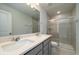 Contemporary bathroom features a double sink vanity and a glass enclosed shower at 123 Royal Cainhoy Way, Huger, SC 29450