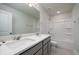 Modern bathroom features a double vanity with a large mirror and a shower-tub combination at 123 Royal Cainhoy Way, Huger, SC 29450