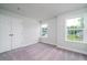 Bright bedroom with plush carpeting, double door closet, and two windows with natural light at 123 Royal Cainhoy Way, Huger, SC 29450