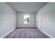 Cozy bedroom with soft carpet, a single window, and a closet providing ample storage at 123 Royal Cainhoy Way, Huger, SC 29450