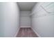 Walk-in closet featuring ample shelving, and neutral carpet for optimal storage at 123 Royal Cainhoy Way, Huger, SC 29450