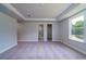 Main bedroom features a tray ceiling and has entrances to the bathroom and a walk-in closet at 123 Royal Cainhoy Way, Huger, SC 29450