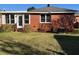 Well-maintained brick home exterior and green backyard with easy access at 1236 Fort Dr, Hanahan, SC 29410