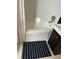 Bathroom showcasing a tub, a white vanity and white tiled floors at 1236 Fort Dr, Hanahan, SC 29410