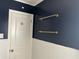 Bathroom features white subway tile, dark blue paint and brass fixtures at 1236 Fort Dr, Hanahan, SC 29410