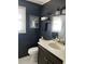 Stylish bathroom with dark walls, marble vanity, and elegant fixtures at 1236 Fort Dr, Hanahan, SC 29410