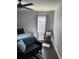 A cozy bedroom boasts hardwood floors, natural lighting from the window, and a comfortable seating area at 1236 Fort Dr, Hanahan, SC 29410