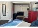 Bedroom boasts closet storage, a red dresser, and a TV set up at 1236 Fort Dr, Hanahan, SC 29410