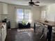 Bright dining area features a modern table, seating for four, and natural light from the adjacent door and window at 1236 Fort Dr, Hanahan, SC 29410