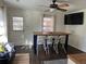 Bright dining area features a modern table, seating for four, and natural light from the adjacent door and window at 1236 Fort Dr, Hanahan, SC 29410