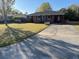 Brick home with a spacious lawn, long driveway, and neat landscaping at 1236 Fort Dr, Hanahan, SC 29410