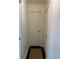 Hallway with hardwood floors and white walls, illuminated by a ceiling light at 1236 Fort Dr, Hanahan, SC 29410