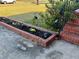 Landscaped flowerbed with flowers and solar lights near the home entrance at 1236 Fort Dr, Hanahan, SC 29410