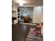 View from mudroom into a cozy living area with a fireplace, comfortable seating, and plenty of natural light at 1236 Fort Dr, Hanahan, SC 29410