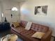 Cozy living room featuring a tufted sofa, neutral decor, and an eye-catching piece of modern art at 1236 Fort Dr, Hanahan, SC 29410
