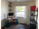 Home office features natural light, a neutral palette, and a modern desk setup at 1236 Fort Dr, Hanahan, SC 29410