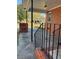 Inviting brick porch with black metal railing and supports, perfect for relaxing outdoors at 1236 Fort Dr, Hanahan, SC 29410