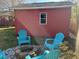 Cozy backyard area featuring a storage shed and Adirondack chairs around a fire pit at 1236 Fort Dr, Hanahan, SC 29410