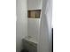 Tiled shower featuring a built-in seat and niche for storage at 1236 Fort Dr, Hanahan, SC 29410