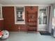 Bright sunroom with exposed brick walls, shelving and a view to outside at 1236 Fort Dr, Hanahan, SC 29410