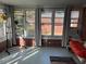Bright sunroom featuring brick walls, curtains and view to the exterior at 1236 Fort Dr, Hanahan, SC 29410