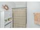 Bright bathroom features a shower/tub combo and white shelving unit at 1325 Telfair Way, Charleston, SC 29412