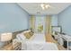 Bedroom with a large window, ceiling fan and desk at 1325 Telfair Way, Charleston, SC 29412