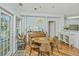Cozy dining area with a wooden table, musical instruments, and elegant decor create a unique and inviting space at 1325 Telfair Way, Charleston, SC 29412