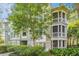 Inviting three story exterior view showcases multiple screened in porches and verdant landscaping at 1325 Telfair Way, Charleston, SC 29412