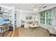 Comfortable living room with natural light, featuring built-in shelves, a desk, and modern furnishings for stylish living at 1325 Telfair Way, Charleston, SC 29412