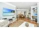 Open-concept living area with hardwood floors, showcasing a dining area and a cozy corner, ideal for seamless living at 1325 Telfair Way, Charleston, SC 29412