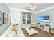 Comfortable living room with TV and neutral decor, featuring a ceiling fan and modern media center, perfect for relaxation at 1325 Telfair Way, Charleston, SC 29412